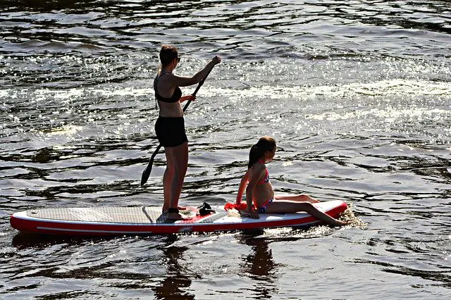 Mom and Daughter Paddle Boarding